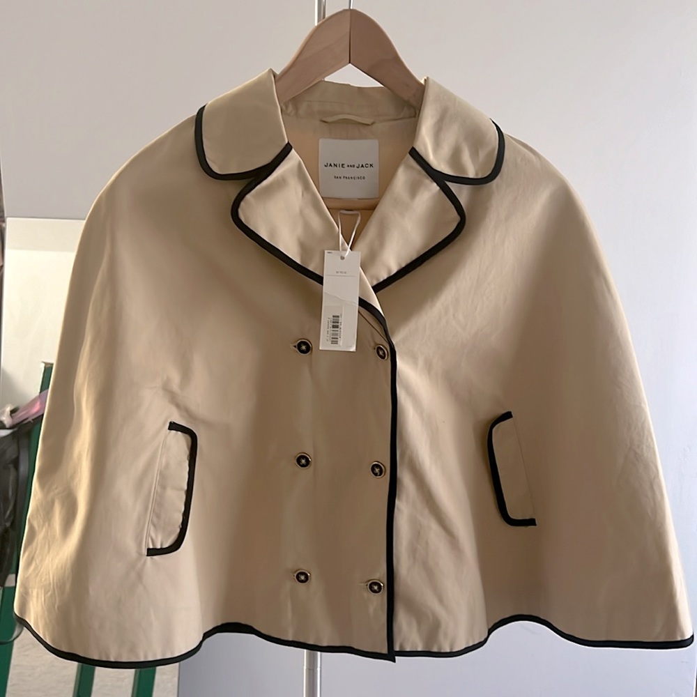 Beautiful Beige cape with black detailing.